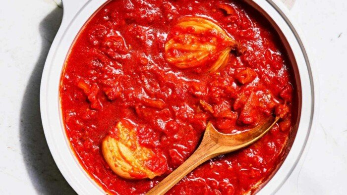 Marcella Hazan Tomato Sauce Recipe Tomato Sauce with Onion and Butter in a White Pot